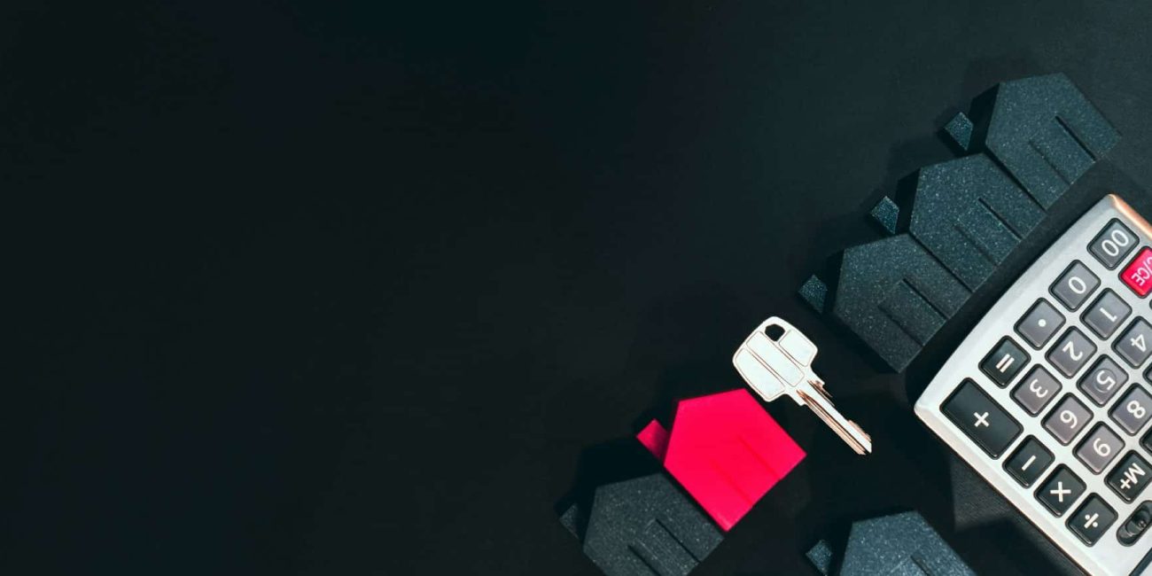 rental home with keys and calculator
