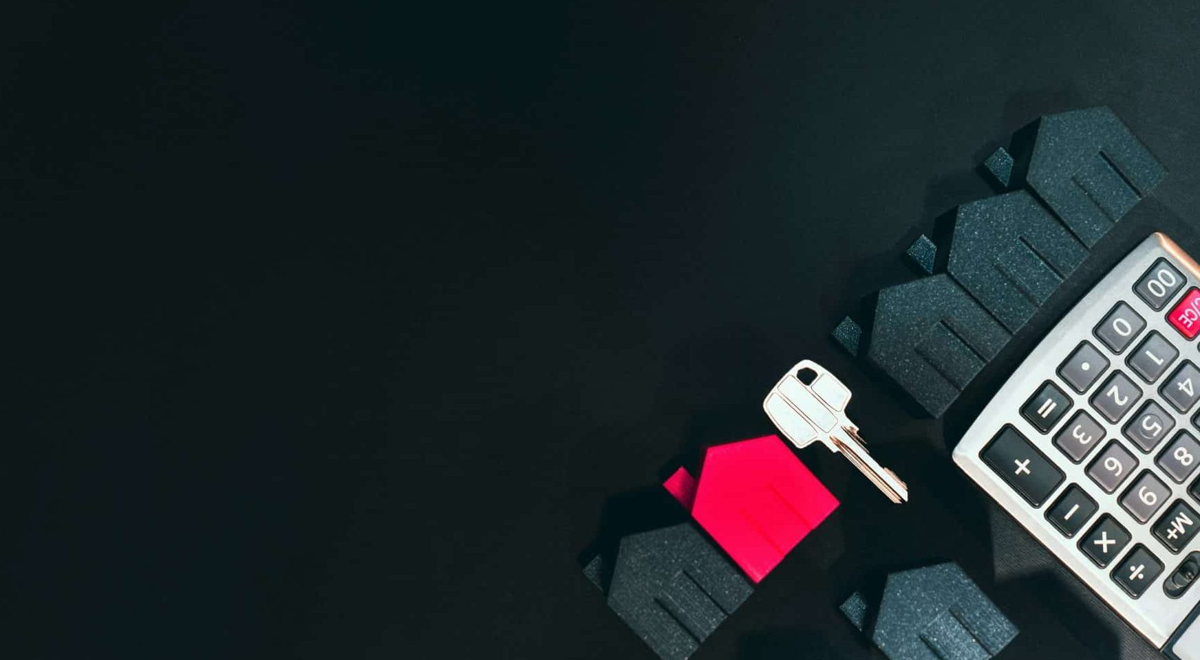 rental home with keys and calculator